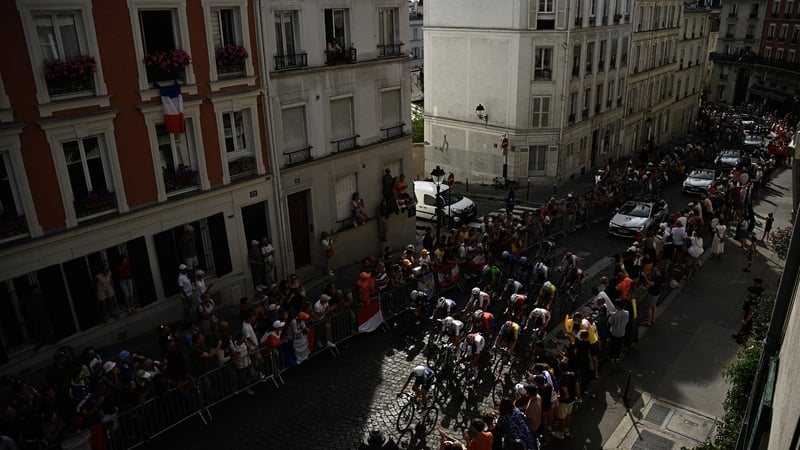 Olympic riders cycle in the ascent of Rue Lepic to the Butte de Montmartre at the 2024 Games