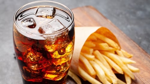 The caffeine, sugar and salt in that Coke and fries can help cope with a migraine attack