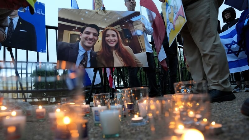 Candles are seen at a vigil near the White House for the victims of the gun attack