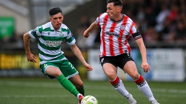 Gavin Whyte of Derry City in action against Cory O'Sullivan of Shamrock Rovers during the SSE Airtricity Men's Premier Division match between Derry City and Shamrock Rovers at The Ryan McBride Brandywell Stadium in Derry. 