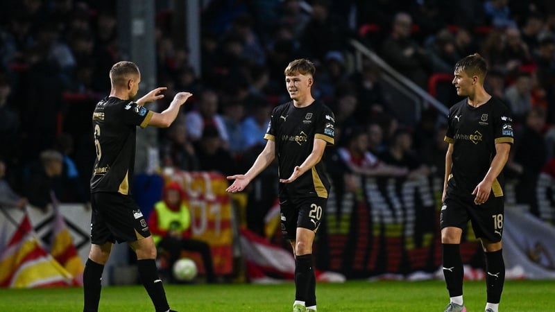 Conan Noonan of Waterford, centre, celebrates with teammate Rowan McDonald, left after scoring Waterford's leveller