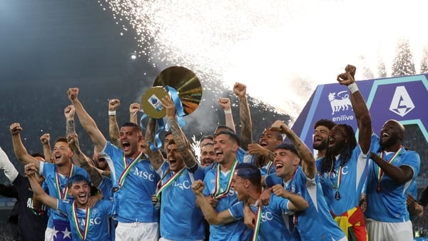 Giovanni Di Lorenzo lifts the league title as Napoli reclaimed the championship for the second time in three years
