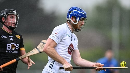 Daire Guerin of Kildare gets away from Niall McFarland
