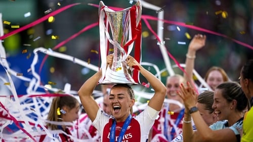 Katie McCabe with the trophy following Arsenal's victory
