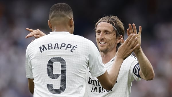 Kylian Mbappe celebrates with Luka Modric who will leave Real Madrid after 13 years