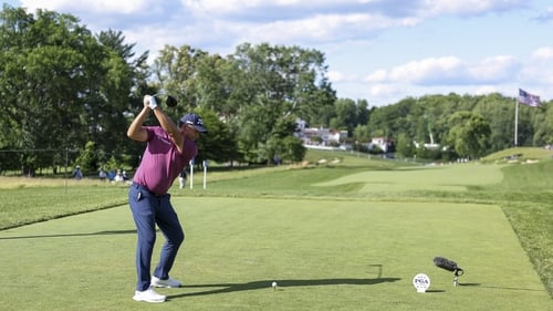 Harrington cracks his tee shot down the 18th at Congressional