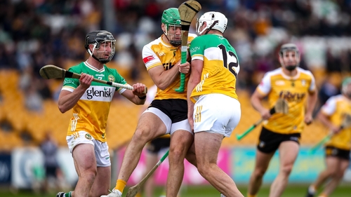 Offaly managed to hold off a 14-man Antrim to secure their status in the Leinster SHC