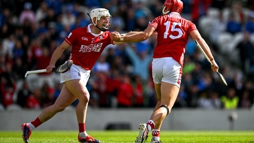 Brian Hayes (R) celebrates with team-mate Patrick Horgan after scoring Cork's first goal