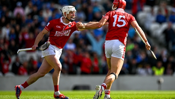 Brian Hayes (R) celebrates with team-mate Patrick Horgan after scoring Cork's first goal