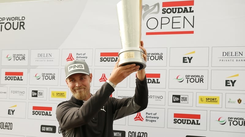 Kristoffer Reitan of Norway lifts the Soudal Open trophy