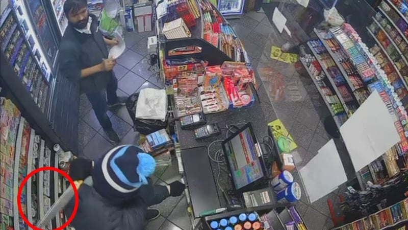 CCTV footage shows Himanshu Kumar (top of frame) threatened with a knife (circled) during a robbery in October 2024