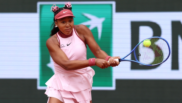 Naomi Osaka plays a backhand