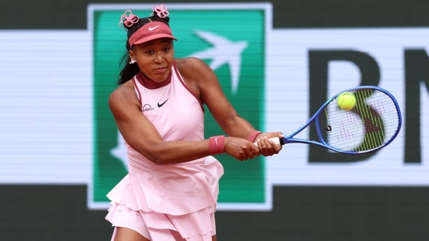 Naomi Osaka of Japan plays a backhand against Paula Badosa of Spain 