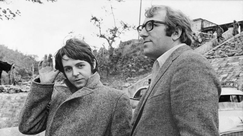 Beatle Paul McCartney with road manager Mal Evans, shown on his arrival in 1968 to join the other Beatles at Maharishi Mahesh Yogi's transcendental meditation center