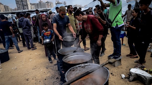 GAZA CITY, GAZA - MAY 27: Charitable organizations distribute hot meals to Palestinians, who are struggling with hunger due to Israel's attacks, in Gaza City, Gaza, on May 27, 2025. As Israel's relentless and devastating attacks on the Gaza Strip continue, Israeli policies have exacerbated the alrea