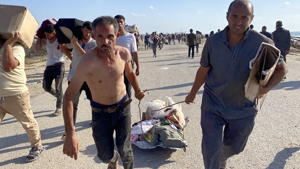RAFAH, GAZA STRIP - MAY 27: Thousands of Palestinians cause a stampede at a humanitarian aid distribution point controlled by the 'Gaza Humanitarian Foundation' in southern Gaza, on May 27, 2025. (Photo by Hani Alshaer/Anadolu via Getty Images)