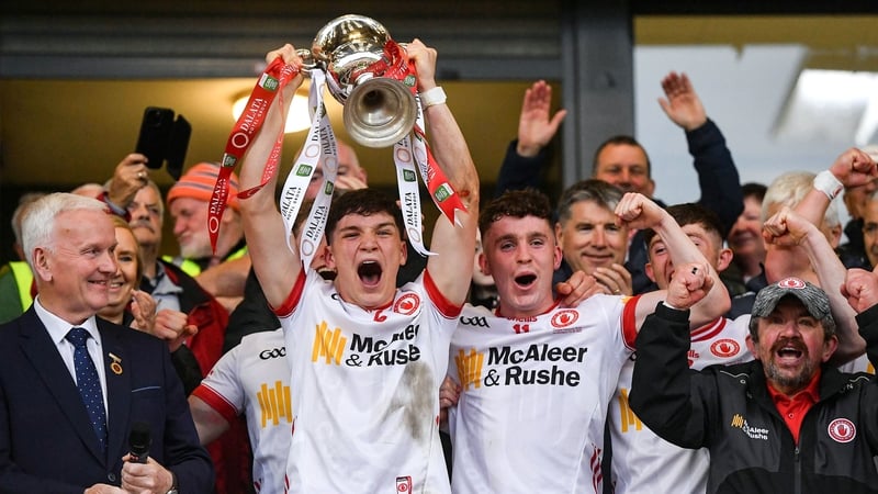 U20 Tyrone captain Joey Clarke, left, lifts the trophy alongside team-mate Eoin McElholm