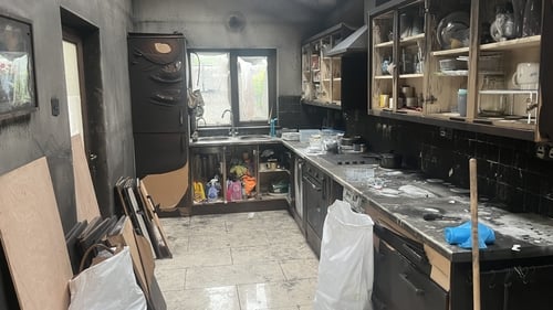Three occupants of the home were treated for non life-threatening injuries but their family dog died in the blaze