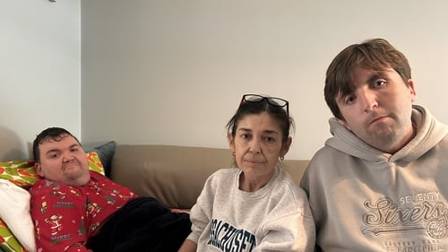 Karen Keely (C) with two of her children Harry (L) and Lorcan (R)