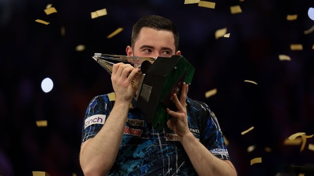 LONDON, ENGLAND - MAY 29: Luke Humphries of England poses with the trophy after winning The Final of the 2025 BetMGM Premier League Darts Play-Offs at The O2 Arena on May 29, 2025 in London, England. (Photo by Andrew Redington/Getty Images)