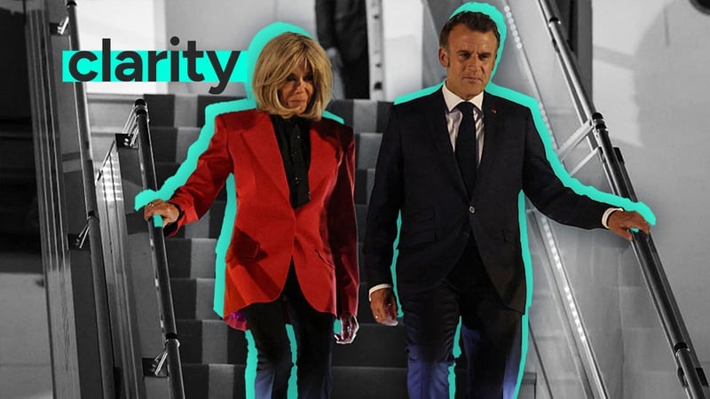 French President Emmanuel Macron disembarks a plane with his wife Brigitte Macron in Hanoi, Vietnam