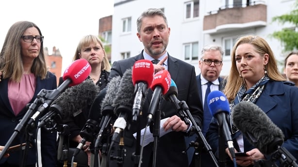 DUBLIN, IRELAND - MAY 30: BBC director Adam Smyth (C) alongside BBC (spotlight) journalist Jennifer O'Leary (R) speaks to the media after losing the defamation case against former Sinn Fein leader Gerry Adams outside the Four Courts on May 30, 2025 in Dublin, Ireland. Gerry Adams is suing the BBC ov