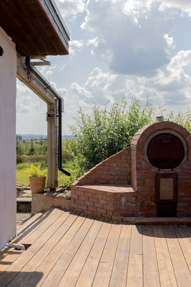a brick oven outside of a house