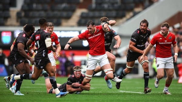 26 October 2024; Tom Ahern of Munster is tackled by James Venter of Hollywoodbets Sharks during the United Rugby Championship match between Hollywoodbets Sharks and Munster at Hollywoodbets Kings Park in Durban, South Africa. Photo by Shaun Roy/Sportsfile