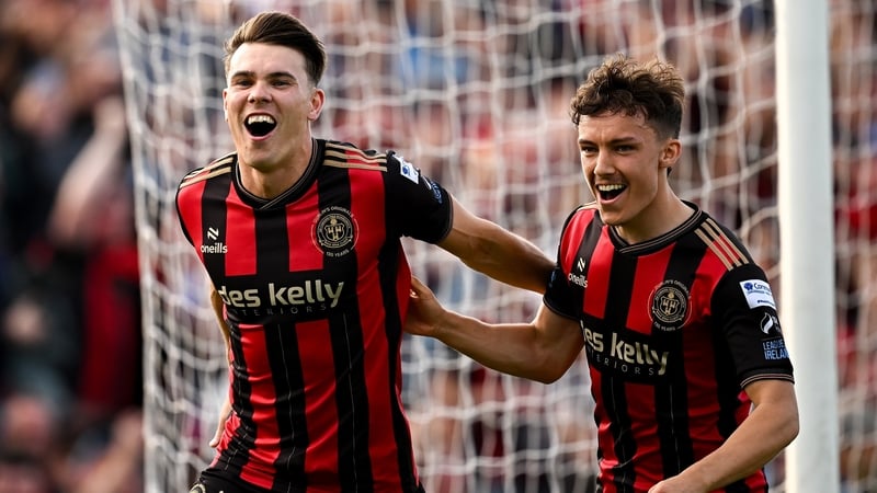 Dayle Rooney (L) celebrates his goal with Archie Meekison