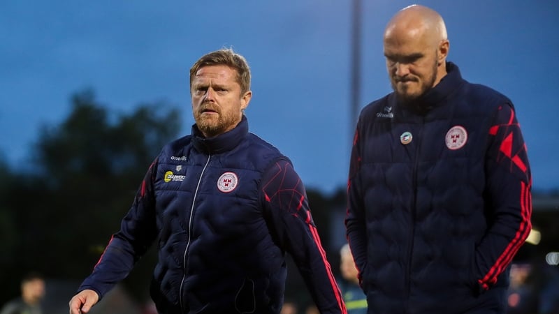 Damien Duff and Joey O'Brien depart the pitch after the 1-1 draw