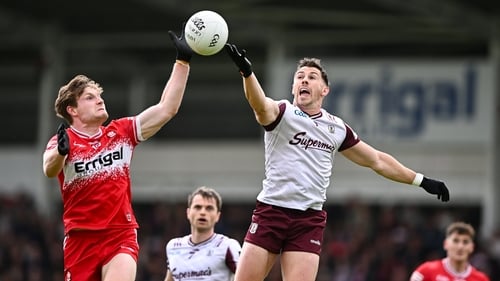 Ethan Doherty and Shane Walsh contest a high ball