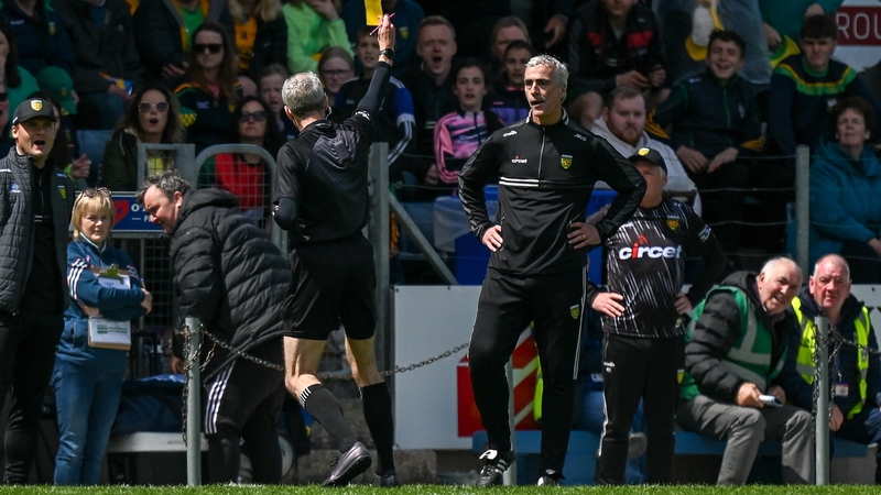 Donegal manager Jim McGuinness is shown a yellow card by referee Fergal Kelly at Kingspan Breffni