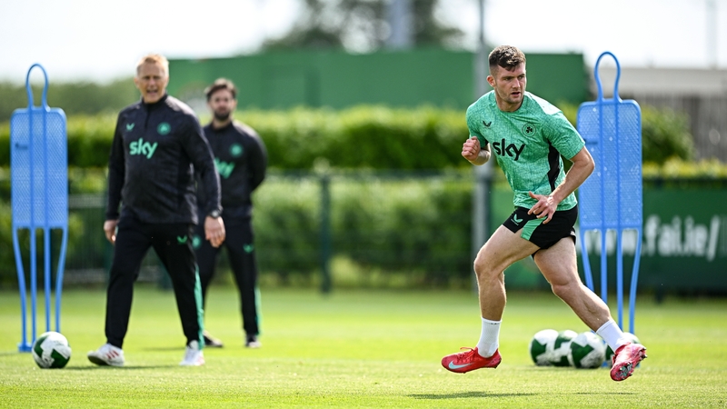 Josh Honohan is watched by Heimir Hallgrimsson during his first Ireland training session