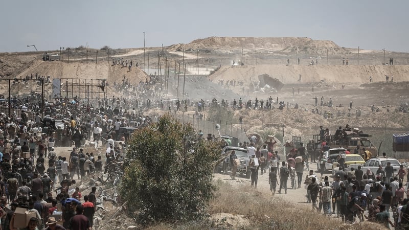 Thousands of Palestinian people people gathered to receive aid from the US-Israeli-backed Gaza Humanitarian Foundation