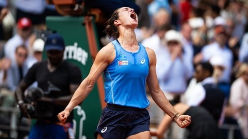 Lois Boisson celebrates after knocking out third seed Jessica Pegula