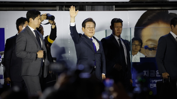 SEOUL, SOUTH KOREA - JUNE 04: Lee Jae-myung, the presidential candidate of the Democratic Party celebrates in front of the National Assembly on June 04, 2025 in Seoul, South Korea. Democratic Party (DP) candidate Lee Jae-myung was certain to win the presi