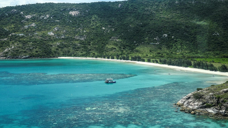 This aerial photo taken on 4 April, 2024, shows a boat anchored near coral around Lizard Island on the Great Barrier Reef