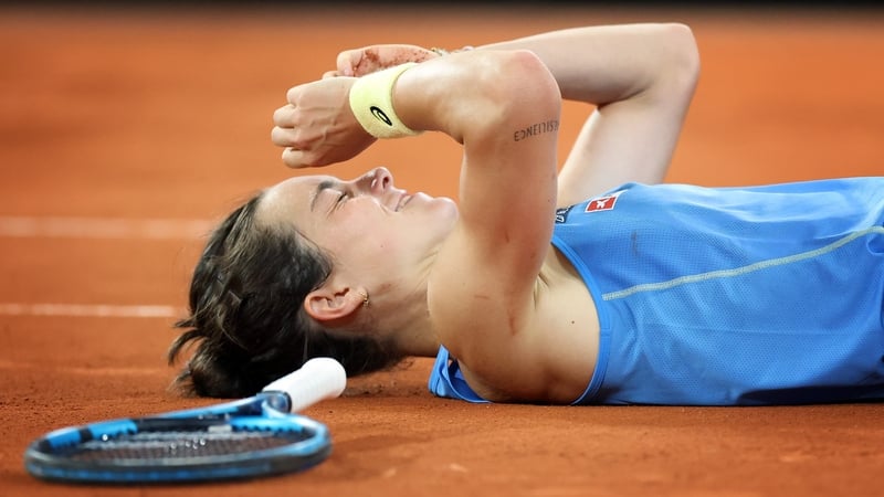 Lois Boisson falls to the ground after her victory