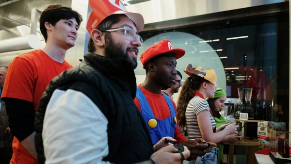 Customers play the Mario Kart video game ahead of the sales launch of the Nintendo Switch 2 gaming console at the Currys Plc store on Oxford Street in London, UK, on Wednesday, June 4, 2025. Nintendo is opening sales of the Switch 2 today, and shoppers ar