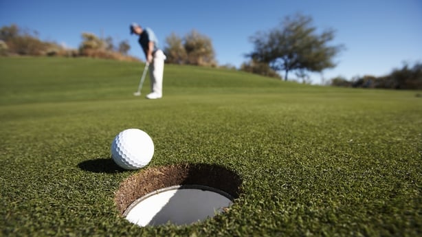 a golf ball near a hole