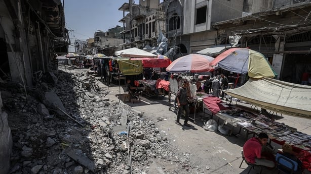 GAZA STRIP - JUNE 5: Residents do their holiday shopping at Al-Zawiya market as Palestinian vendors open their stalls on the eve of Eid al-Adha, despite ongoing Israeli attacks on the Gaza Strip and the closure of border crossings that have led to widespread shortages, in Gaza on June 5, 2025. (Phot