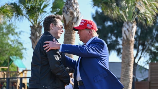 BROWNSVILLE, TEXAS - NOVEMBER 19: U.S. President-elect Donald Trump greets Elon Musk as he arrives to attend a viewing of the launch of the sixth test flight of the SpaceX Starship rocket on November 19, 2024 in Brownsville, Texas. SpaceX's billionaire owner, Elon Musk, a Trump confidante, has been 
