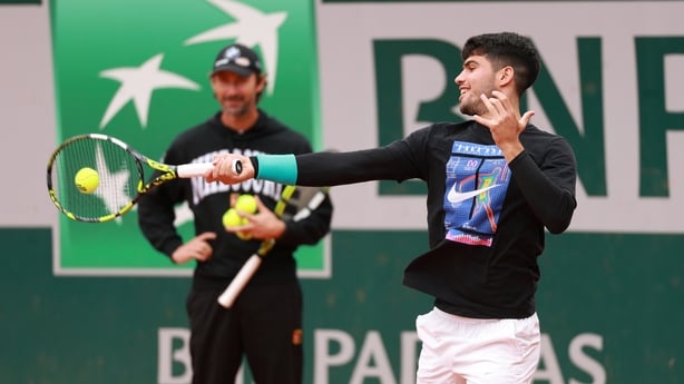 PARIS, FRANCE - JUNE 07: Carlos Alcaraz of Spain warms up during a practice session watched by his coach Juan Carlos Ferrero the day before playing in the Men's Singles Final against Jannik Sinner of Italy during Day Fourteen of the 2025 French Open at Roland Garros on June 07, 2025 in Paris, France