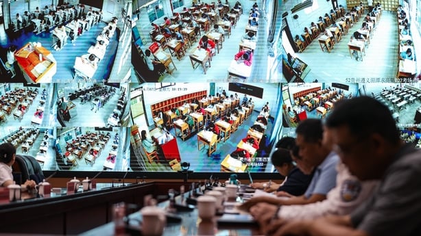 GUIYANG, CHINA - JUNE 07: Staff members of the Educational Enrollment and Examination Center work at a monitoring room equipped with real-time intelligent surveillance system on the first day of national college entrance exam, also known as the gaokao, on June 7, 2025 in Guiyang, Guizhou Province of