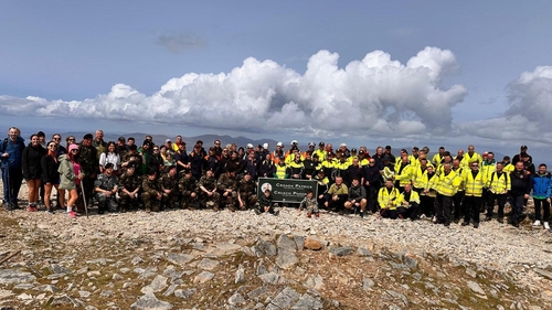 The climb culminated with a group photograph at the summit of the Reek