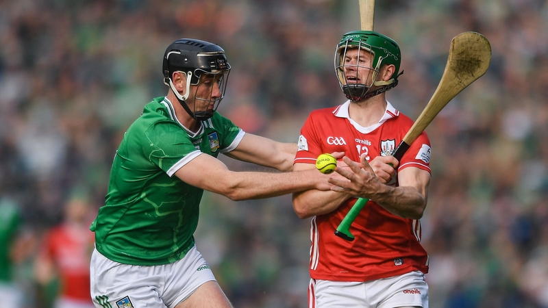 Cork's Séamus Harnedy (R) in action against Diarmaid Byrnes of Limerick during the Munster final