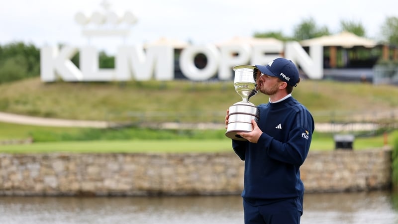 Connor Syme celebrates with the trophy in Amsterdam