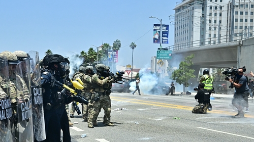 Law enforcement clash with demonstrators outside the Metropolitan Detention Center in Los Angeles