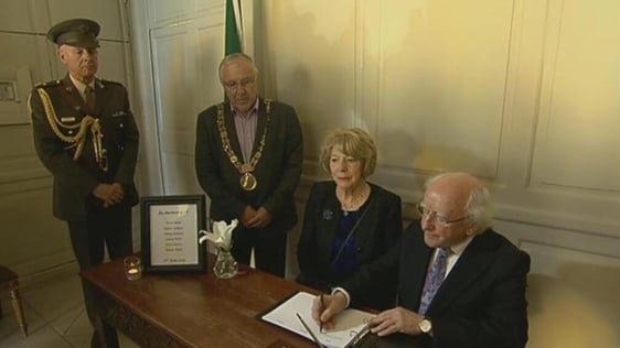 President Michael D Higgins signs book of condolence, Mansion House (2015)