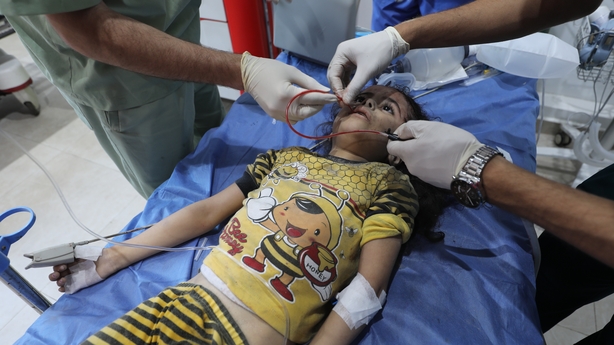 GAZA STRIP - JUNE 7: Injured Palestinian children are taken to Al-Awda Hospital for treatment after the Israeli army launched an attack on a house belonging to the Abu Sueayh family in the Nuseirat Refugee Camp in the central Gaza Strip on the second day of Eid al-Adha, causing many casualties and i